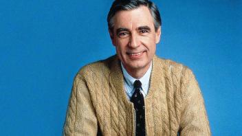 Fred Rogers portrait wearing tan sweater