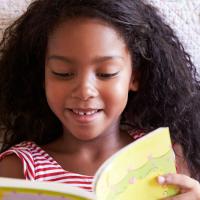bird's eye view of young girl reading